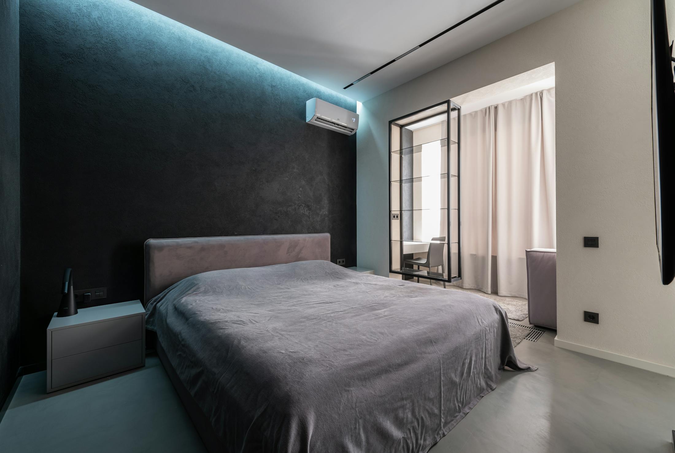 Bedroom with discreet wall mounted air conditioning